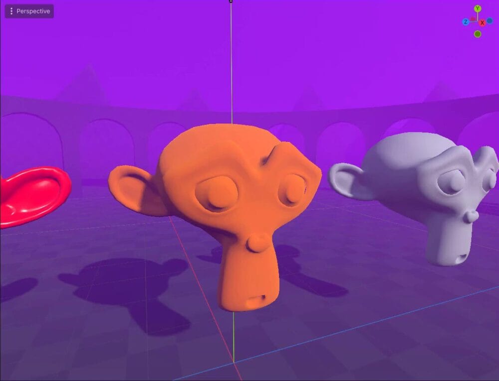 How to Use Godot Materials and Set Up 3D Environments 8 Godot 3D viewport with a red monkey mesh and a golden monkey mesh after setting albedo, metallic, and roughness.