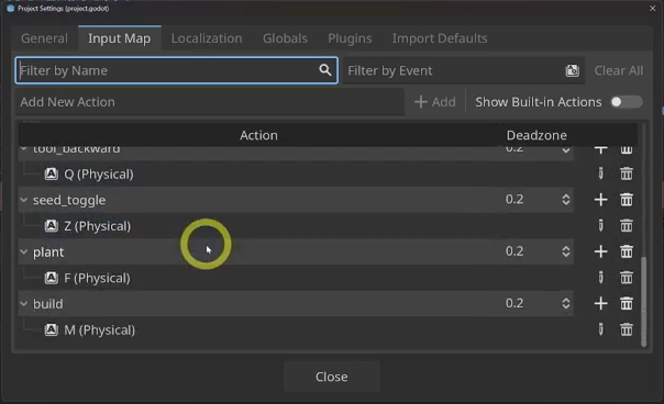 The Godot Project Settings Input Map showing the build action bound to the M key.